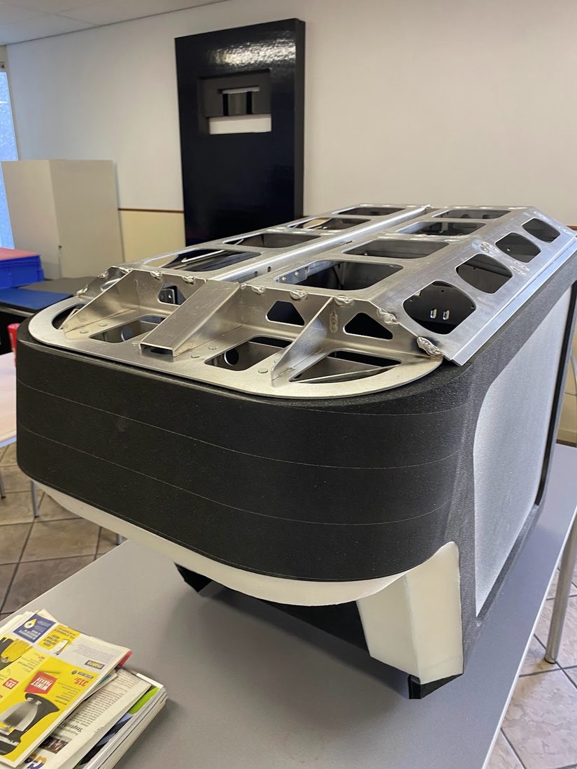 The DOCKR box mid-build: layered polyurethane foam body with its welded aluminium frame, before the protective coatings
